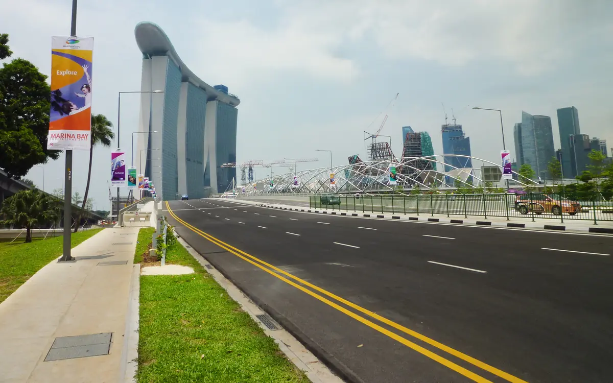 Bayfront Avenue at Marina Bay in daylight, with the Helix Bridge and the Marina Bay Sands hotel towers beyond