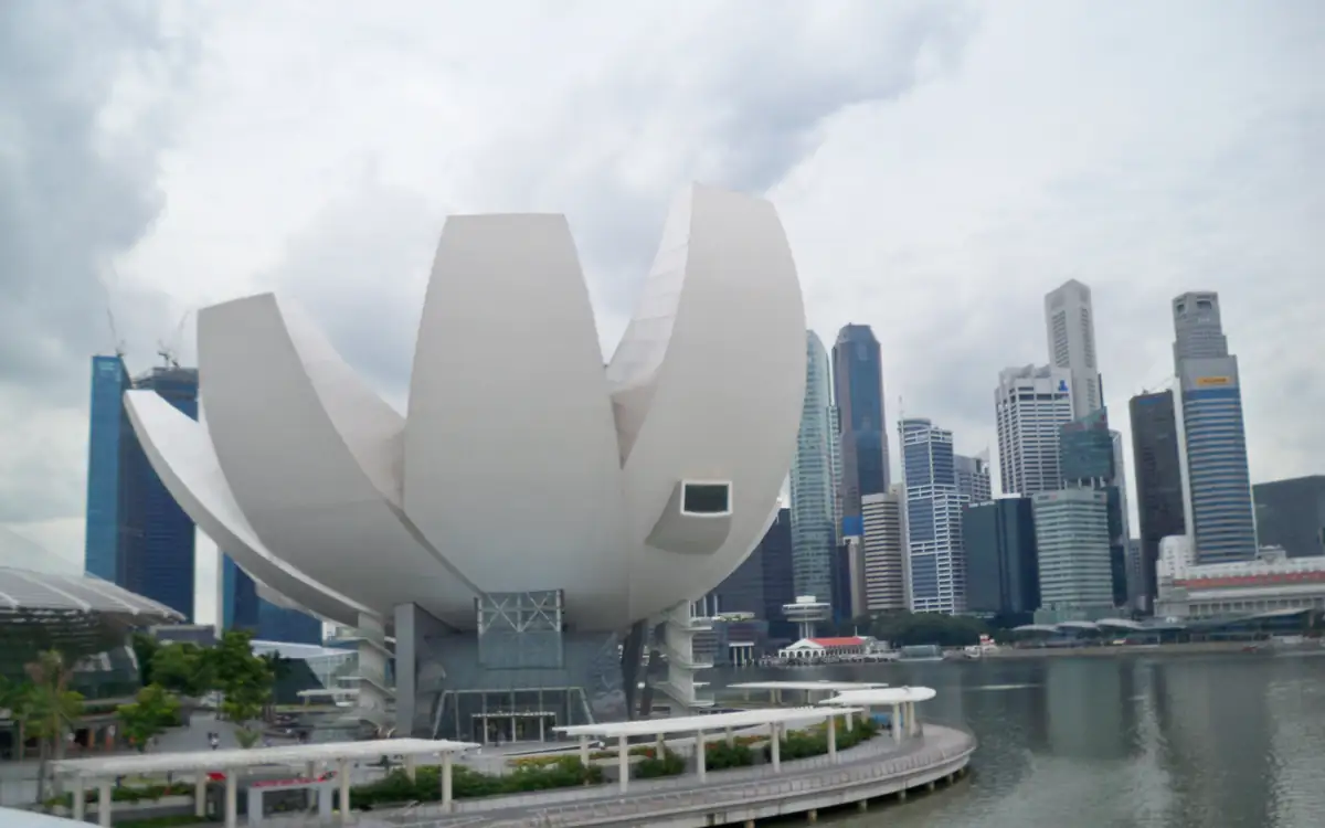 The Art Science Museum at Marina Bay, its white lotus-like petals rising above the waterfront with the skyline behind it