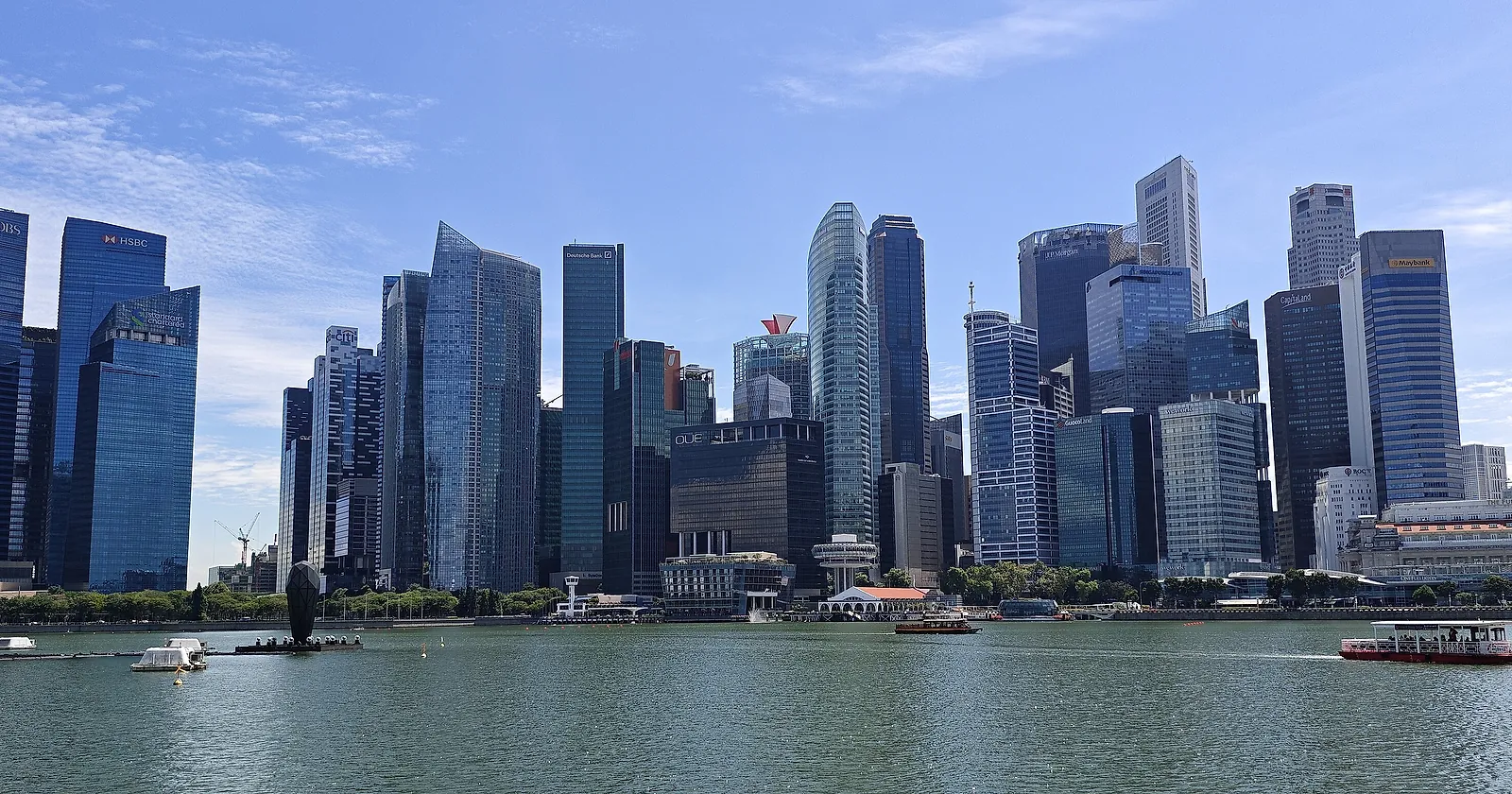The Singapore central business district skyline across Marina Bay on a clear day